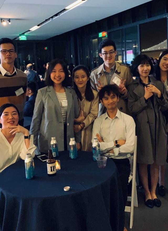 Maxine Li and Michael Chen join other MSBA students at a mixer