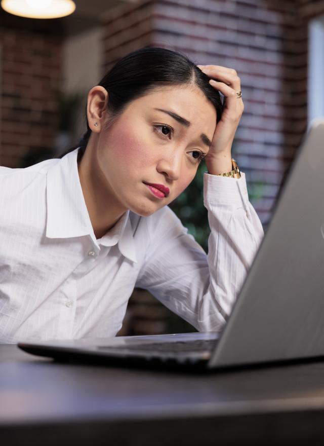 Pay Gender Gap - woman at laptop