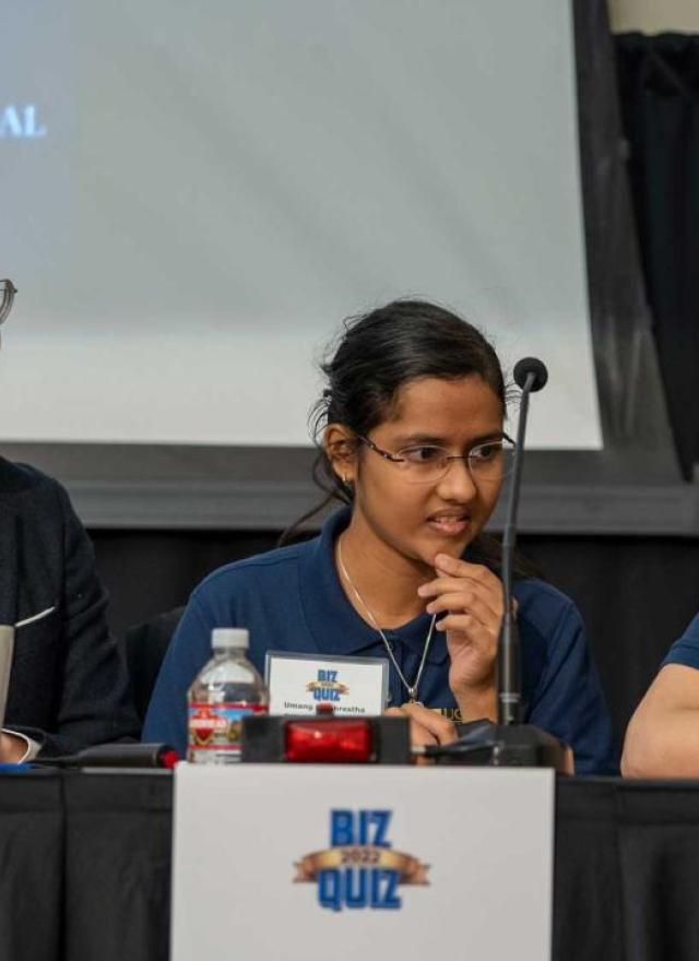 Biz Quiz competitors sitting at a table