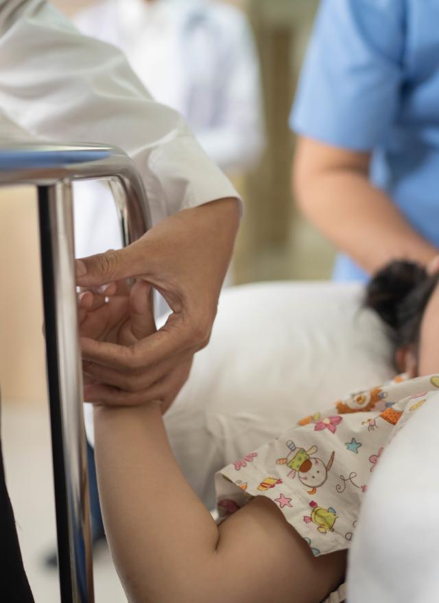 girl laying in hospital gurney