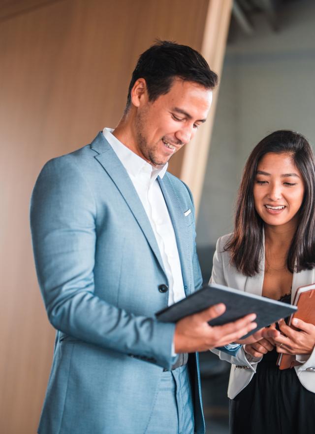 Man and woman dressed in professional attire