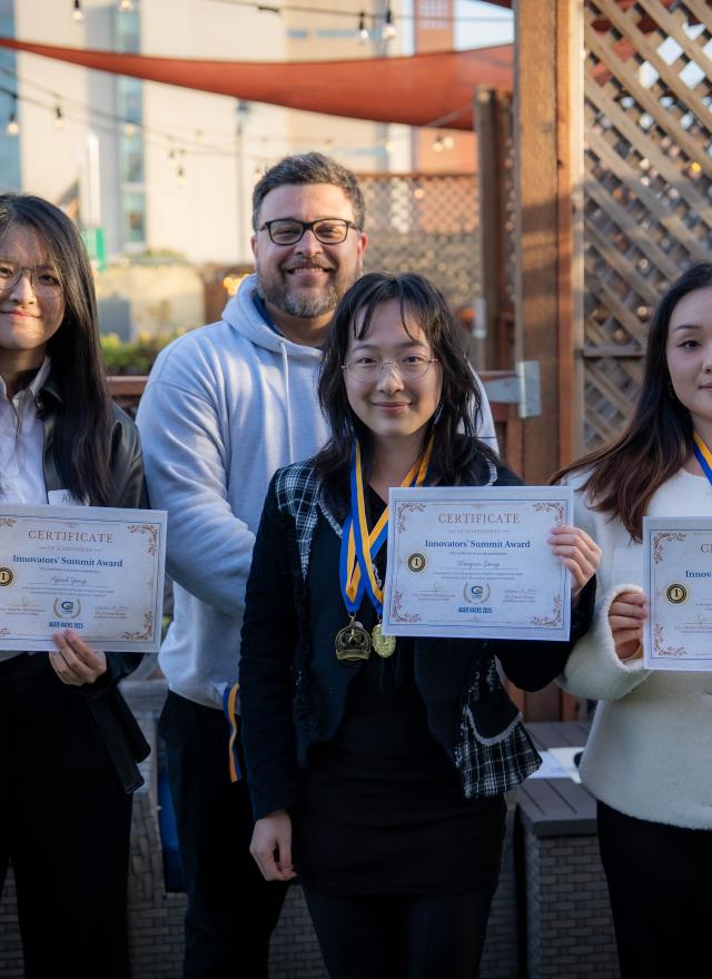 MSBA Hackathon winners hold up their certificates 