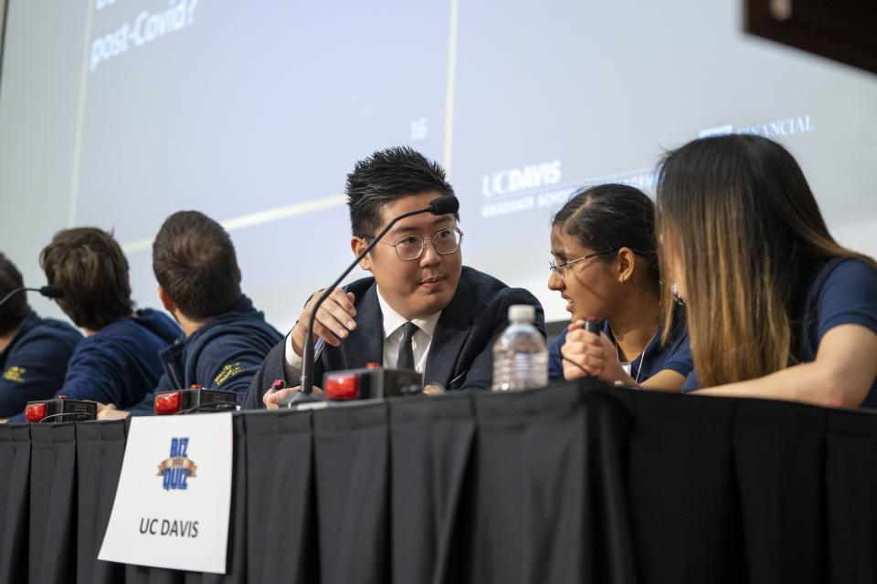 Group of people conversing at a table