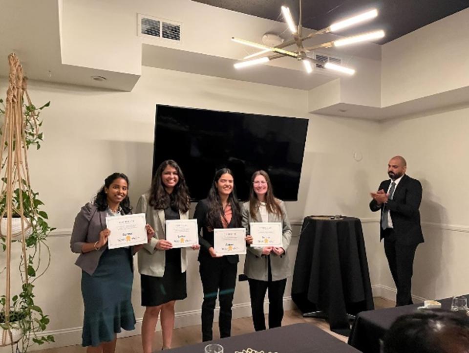 MSBA students holding up certificates