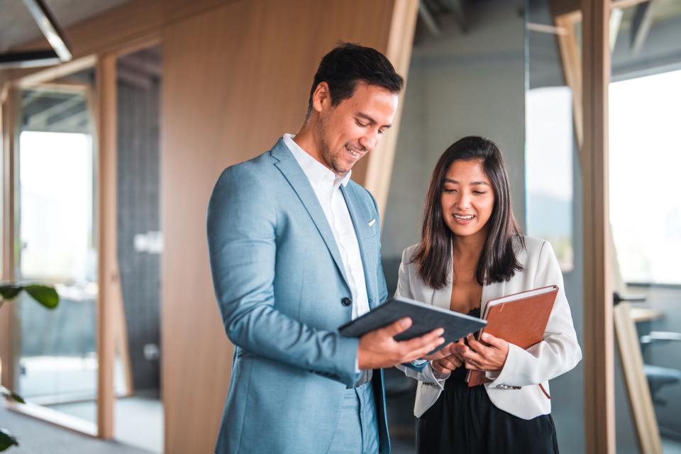 Man and woman dressed in professional attire