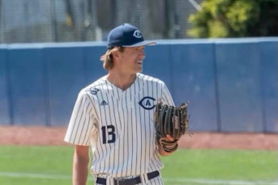 Carter Delaney wearing a baseball uniform and standing on the pitcher's mound